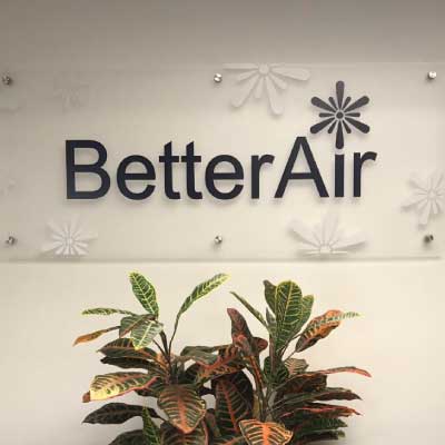 Frosted acrylic plastic sign with black lettering. Text reads: BetterAir