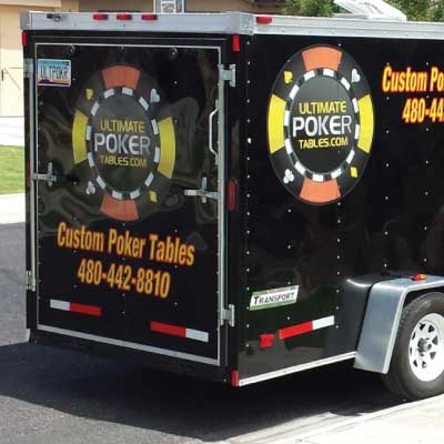 Yellow text with red outline. Logo of a yellow, red and black poker chip. Text reads: Ultimate Poker Tables.com. Custom Poker Tables