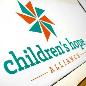 Children's Hope armour-wood business sign in turqoise and orange