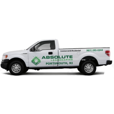 Side view of white regular cab Ford F-150 pickup truck with custom vinyl lettering